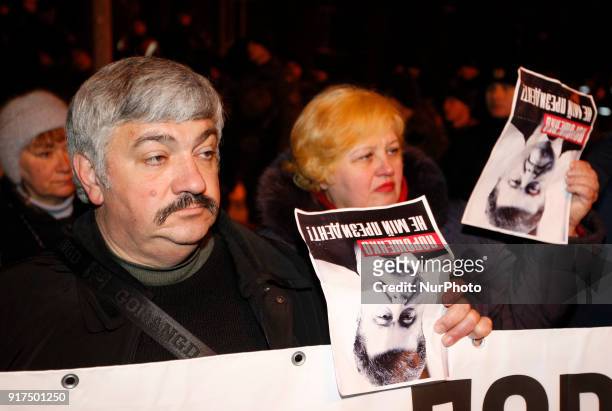 Supporters of the former Georgian President Mikheil Saakashvili attend a protest against his deportation, hold banners reading &quot;Poroshenko is...