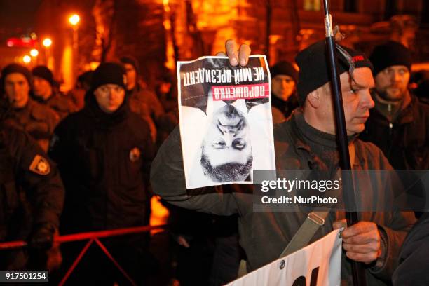 Supporters of the former Georgian President Mikheil Saakashvili attend a protest against his deportation, hold banners reading &quot;Poroshenko is...