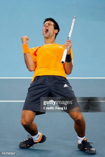 Novak Djokovic of Serbia celebrates a shot against Marin Cilic of Croatia in the men's final match during day ten of the 2009 China Open at the...