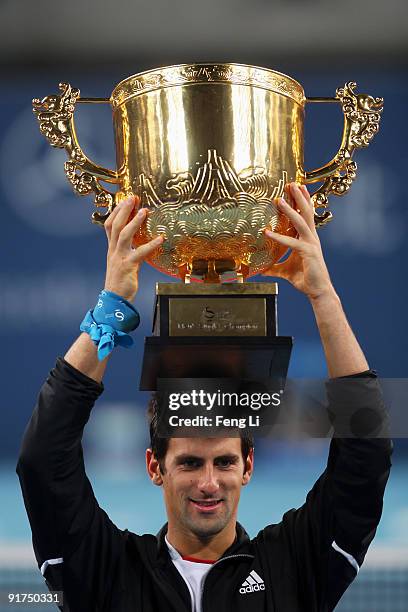 Novak Djokovic of Serbia poses with his trophy after victory against Marin Cilic of Croatia in the men's final match on day ten of the 2009 China...