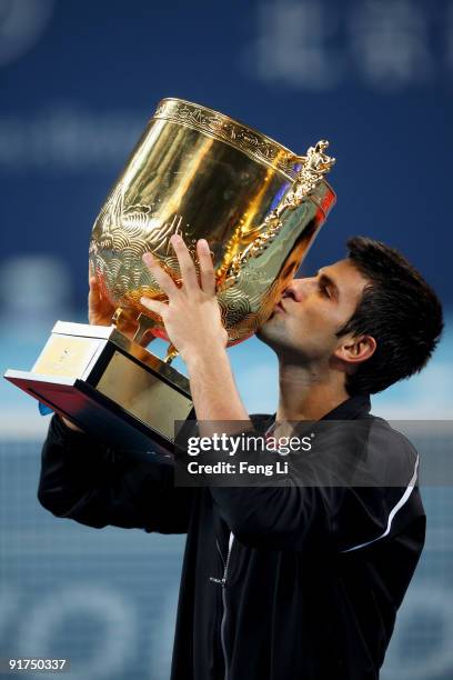 Novak Djokovic of Serbia poses with his trophy after victory against Marin Cilic of Croatia in the men's final match on day ten of the 2009 China...