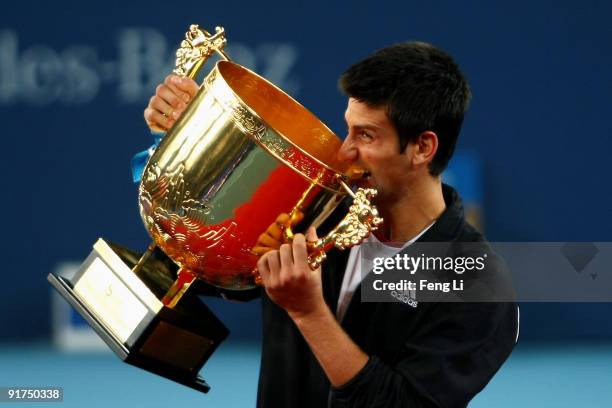 Novak Djokovic of Serbia poses with his trophy after victory against Marin Cilic of Croatia in the men's final match on day ten of the 2009 China...