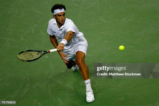 Feliciano Lopez of Spain returns a shot to Guillermo Garcia-Lopez of Spain during day one of the 2009 Shanghai ATP Masters 1000 at Qi Zhong Tennis...