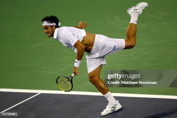 Feliciano Lopez of Spain serves to Guillermo Garcia-Lopez of Spain during day one of the 2009 Shanghai ATP Masters 1000 at Qi Zhong Tennis Centre on...