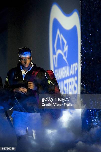 Feliciano Lopez of Spain enters center court before his match against compatriot Guillermo Garcia-Lopez during day one of 2009 Shanghai ATP Masters...