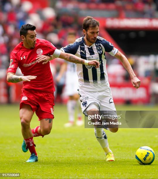 Rubens Sambueza ofl Toluca fights for the ball with Jose Basanta of Monterrey during the 6th round match between Toluca and Monterrey as part of the...