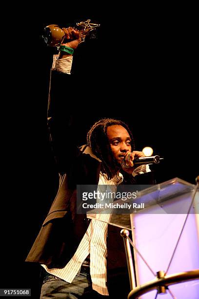 Thokozani Dube accepts the Legend Awards on behalf of his deceased father Lucky Dube at the MTV Africa Music Awards with Zain at the Moi...