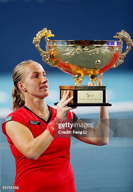 Svetlana Kuznetsova of Russia poses with her trophy after victory in the women's final match against Agnieszka Radwanska on day ten of the 2009 China...