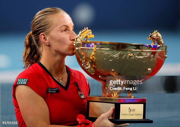 Svetlana Kuznetsova of Russia poses with her trophy after victory in the women's final match against Agnieszka Radwanska on day ten of the 2009 China...