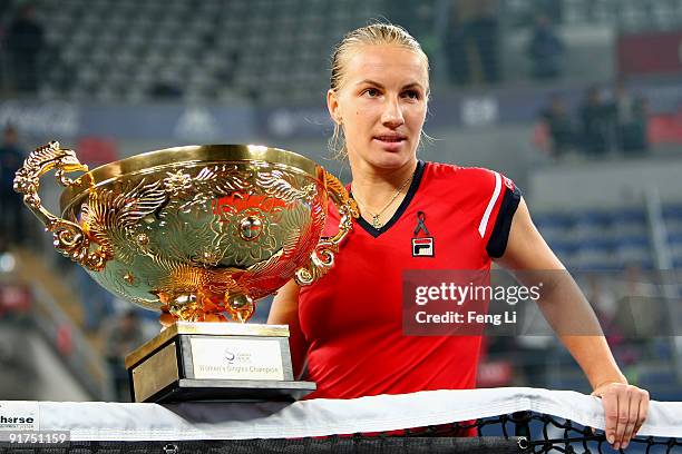 Svetlana Kuznetsova of Russia poses with her trophy after victory in the women's final match against Agnieszka Radwanska on day ten of the 2009 China...