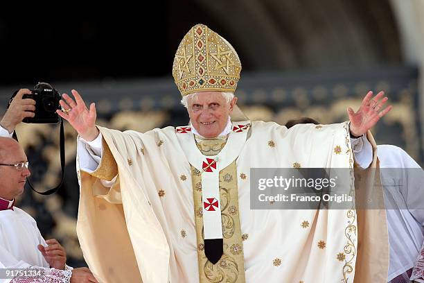 Pope Benedict XVI delivers his blessing to the faithful gathered in St. Peter's Square at the end of a canonisation ceremony on October 11, 2009 in...