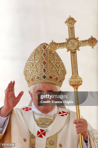 Pope Benedict XVI delivers his blessing to the faithful gathered in St. Peter's Square at the end of a canonisation ceremony on October 11, 2009 in...