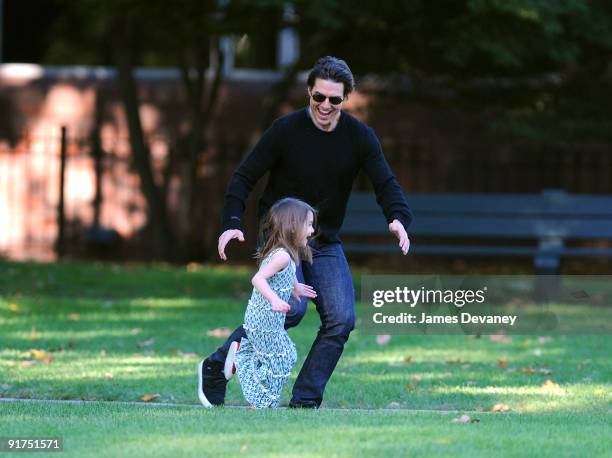 Tom Cruise and Suri Cruise visit Charles River Basin on October 10, 2009 in Cambridge, Massachusetts.