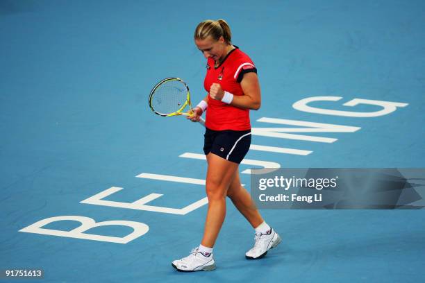 Svetlana Kuznetsova of Russia celebrates a shot against Agnieszka Radwanska of Poland in the women's final match during day ten of the 2009 China...