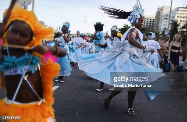 Revelers dance during the Afoxe Ile Ala 'bloco', or block party, on February 12, 2018 in Rio de Janeiro, Brazil. The bloco celebrates the...