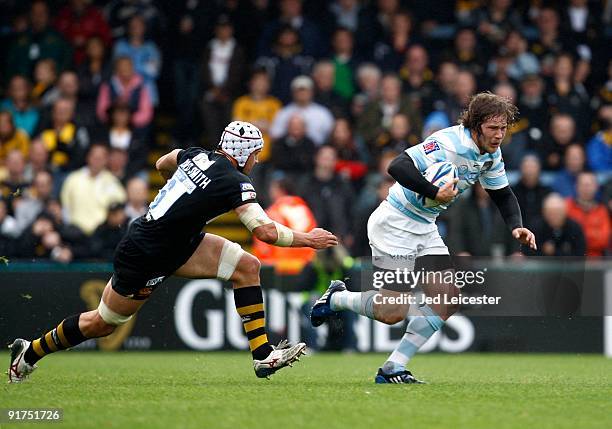 Racing Metro's Francois Steyn gets past Wasps' Dan Ward Smith before going off the field injured during the Amlin Challenge Cup match between London...