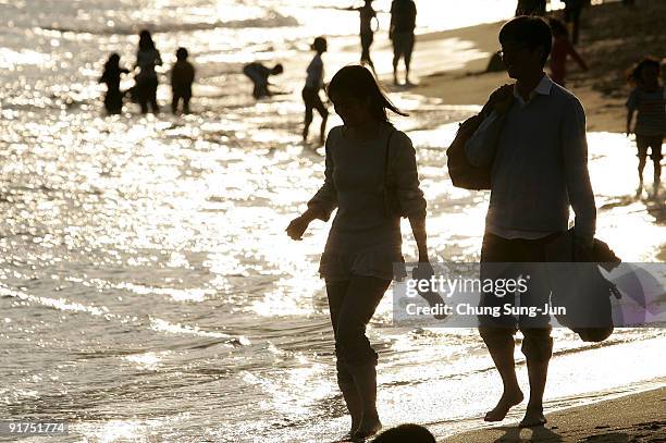 Tourists enjoy at the PIFF Plaza during the 14th Pusan International Film Festival at the Haeundae beach on October 11, 2009 in Busan, South Korea....