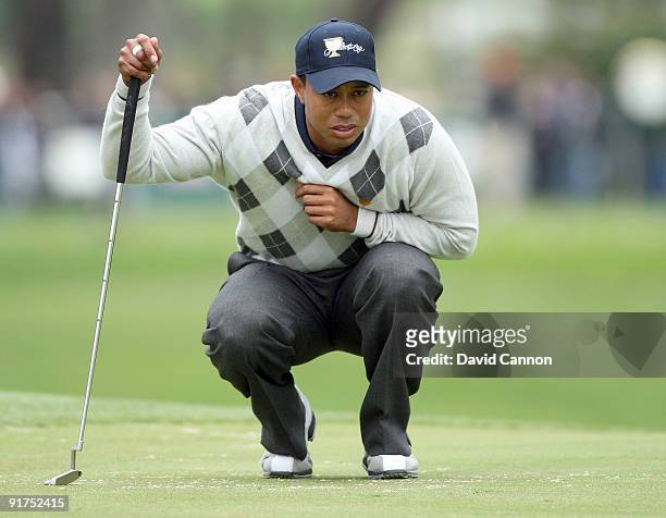 Tiger Woods of the USA Team plays his second shot at the 16th hole during the Day Three Afternoon Fourball Matches in The Presidents Cup at Harding...