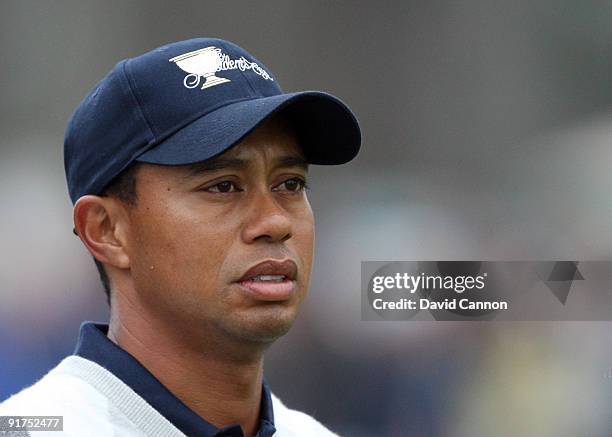 Tiger Woods of the USA Team plays his second shot at the 16th hole during the Day Three Afternoon Fourball Matches in The Presidents Cup at Harding...