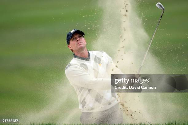 Steve Stricker of the USA Team plays his third shot at the 16th hole during the Day Three Afternoon Fourball Matches in The Presidents Cup at Harding...