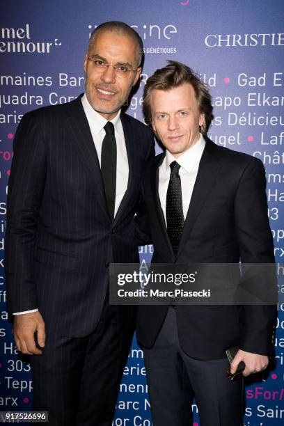 Kamel Mennour and actor Alex Lutz attend the 'Heroes for Imagine' host by Kamel Mennour benefit auction at L'Institut Imagine on February 12, 2018 in...