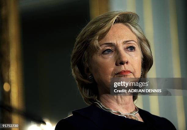 Secretary of State Hillary Rodham Clinton looks toward the press during a a press conference with Britain's Foreign Secretary David Miliband at No.1...