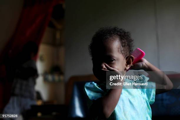 Portrait of HIV positive since birth Safira, 7-years old whose parents have died of AIDS on October 6, 2009 in Merauke, West Papua near Jayapura,...