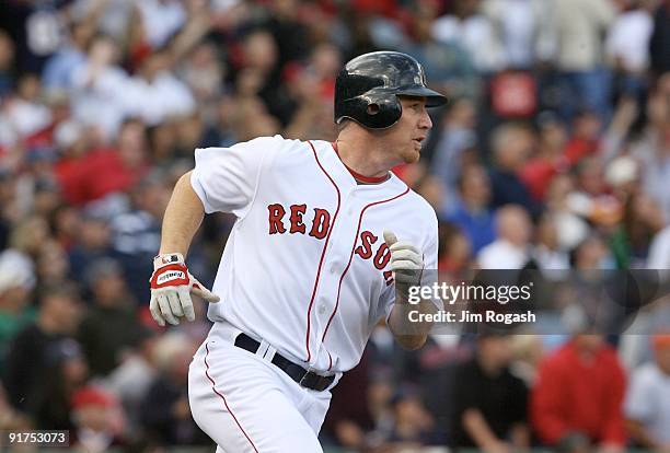 Drew of the Boston Red Sox rounds the bases as he hits a home run in the fourth inning against the Los Angeles Angels of Anaheim in Game Three of the...