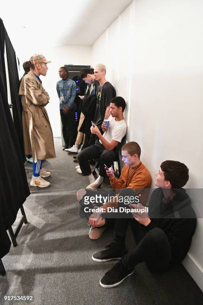 Models prepare backstage at the Libertine fashion show during New York Week: The Shows at Gallery II at Spring Studios on February 12, 2018 in New...