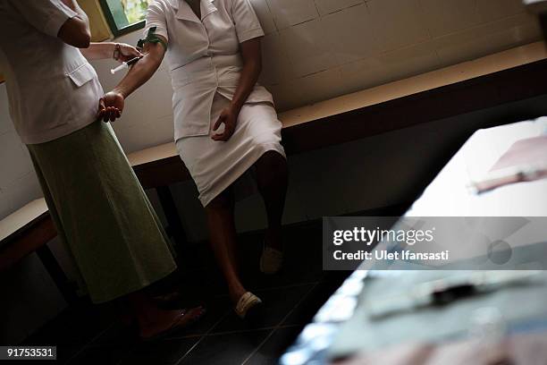 Positive patients receive treatment in a hospital on October 5, 2009 in Merauke, West Papua near Jayapura, Indonesia. The incidence of HIV and AIDS...