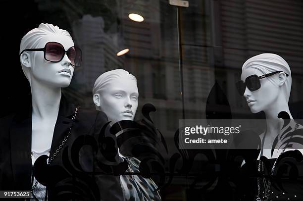 mannequins in the shop window - fashion male and female stock pictures, royalty-free photos & images