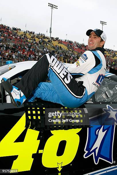 Jimmie Johnson, driver of the Lowe's Chevrolet, climbs into his car prior to the start of the NASCAR Sprint Cup Series Pepsi 500 at Auto Club...