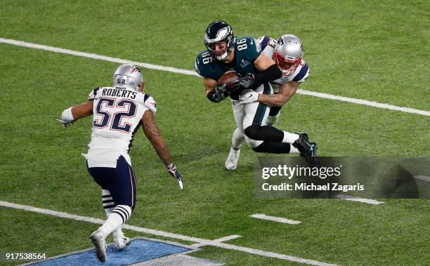 Zach Ertz of the Philadelphia Eagles gets tackled after making a reception during the game against the New England Patriots in Super Bowl LII at U.S....