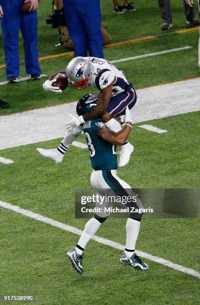 Rodney McLeod#23 of the Philadelphia Eagles tackles Brandin Cooks of the New England Patriots in Super Bowl LII at U.S. Bank Stadium on February 4,...