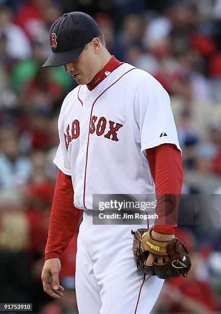 Pitcher Jonathan Papelbon of the Boston Red Sox reacts after allowing three runs in the ninth inning to blow the save against the Los Angeles Angels...