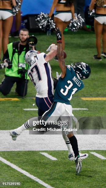 Jalen Mills of the Philadelphia Eagles breaks up a pass to Rob Gronkowski of the New England Patriots in Super Bowl LII at U.S. Bank Stadium on...