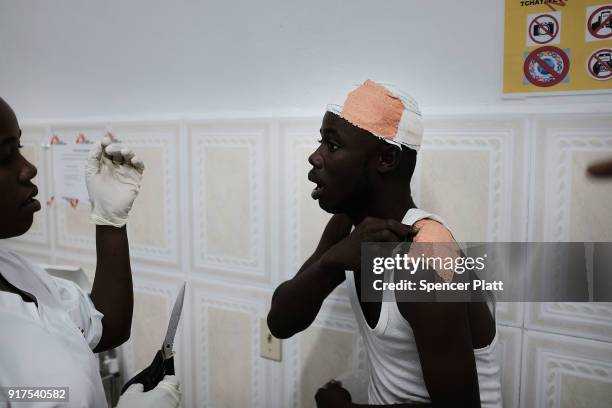 Man is bandaged after a motorcycle accident at the Martissant hospital in Port-au-Prince which is operated by Medecins Sans Frontieres/Doctors...