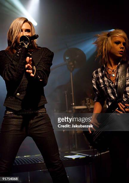 Singer Strify and bassist Kiro of the German rock band Cinema Bizarre perform live during a concert at the Postbahnhof on October 11, 2009 in Berlin,...