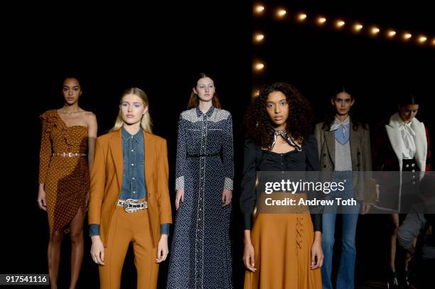 Models pose on the runway for the Veronica Beard Fall 2018 presentation at Highline Stages on February 12, 2018 in New York City.