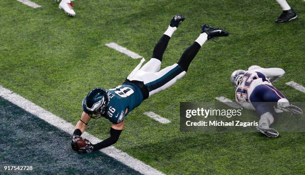 Zach Ertz of the Philadelphia Eagles dives into the end zone for an 11-yard touchdown during the game against the New England Patriots in Super Bowl...