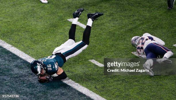 Zach Ertz of the Philadelphia Eagles dives into the end zone for an 11-yard touchdown during the game against the New England Patriots in Super Bowl...