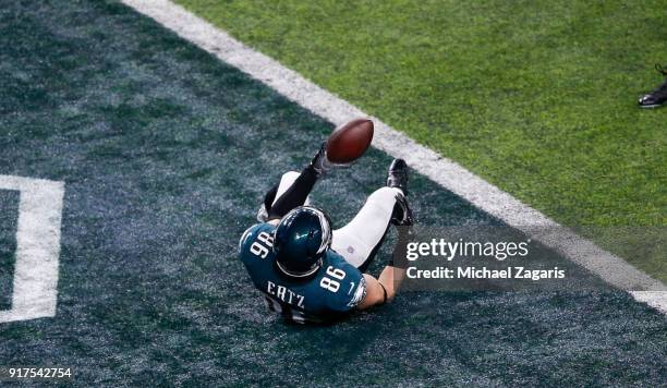 Zach Ertz of the Philadelphia Eagles juggles the ball in the end zone for an 11-yard touchdown during the game against the New England Patriots in...