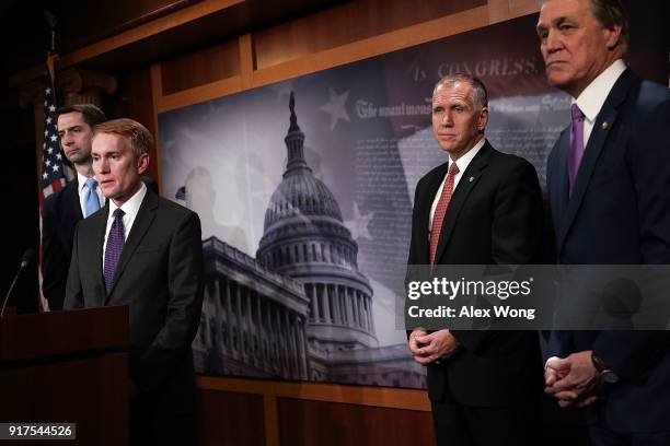Sens. Tom Cotton , James Lankford , Thom Tillis and David Perdue listen during a news conference on immigration February 12, 2018 at the Capitol in...