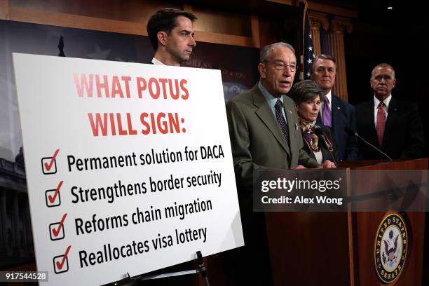 Sen. Chuck Grassley speaks as Sens. Tom Cotton , Joni Ernst , David Perdue and Thom Tillis listen during a news conference on immigration February...