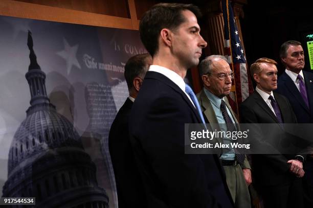 Sens. Tom Cotton , Chuck Grassley , James Lankford and David Perdue listen during a news conference on immigration February 12, 2018 at the Capitol...
