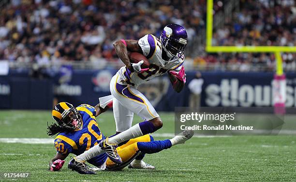 Wide receiver Bernard Berrian of the Minnesota Vikings runs the ball past Jonathan Wade of the St. Louis Rams at Edward Jones Dome on October 11,...