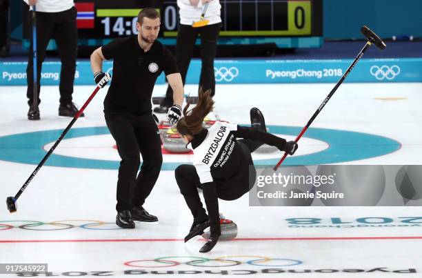 Anastasia Bryzgalova of Olympic Athletes from Russia falls as she competes against Norway during the Curling Mixed Doubles Bronze Medal Game on day...