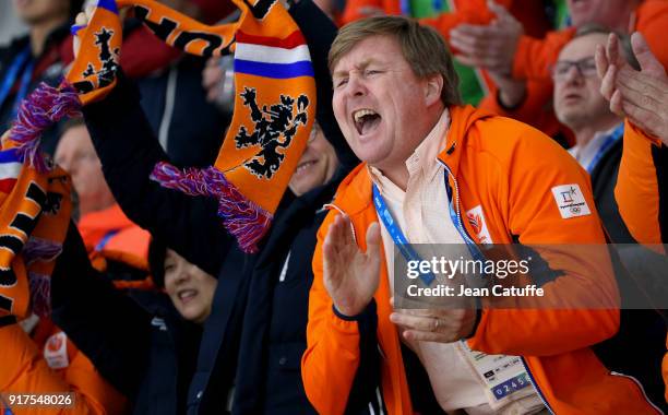 King Willem-Alexander of the Netherlands celebrates the gold medal of Ireen Wust and the bronze medal of Marrit Leenstra in the Speed Skating Ladies'...