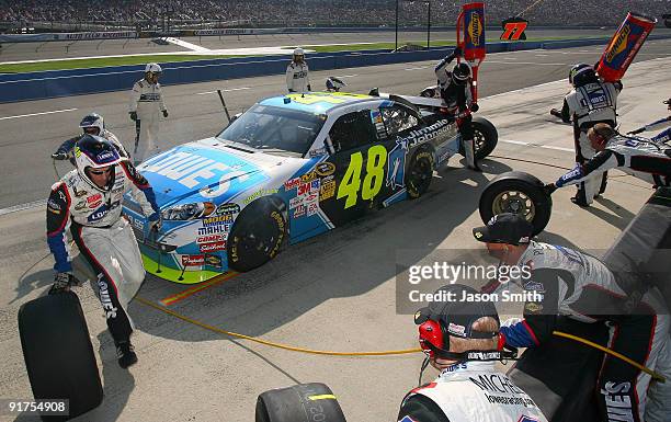 Jimmie Johnson pits the Jimmie Johnson Foundation/Lowe's Chevrolet during the NASCAR Sprint Cup Series Pepsi 500 at Auto Club Speedway on October 11,...