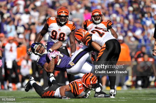 Ray Rice of the Baltimore Ravens makes a catch and gets tackled by the Cincinnati Bengals at M&T Bank Stadium on October 11, 2009 in Baltimore,...